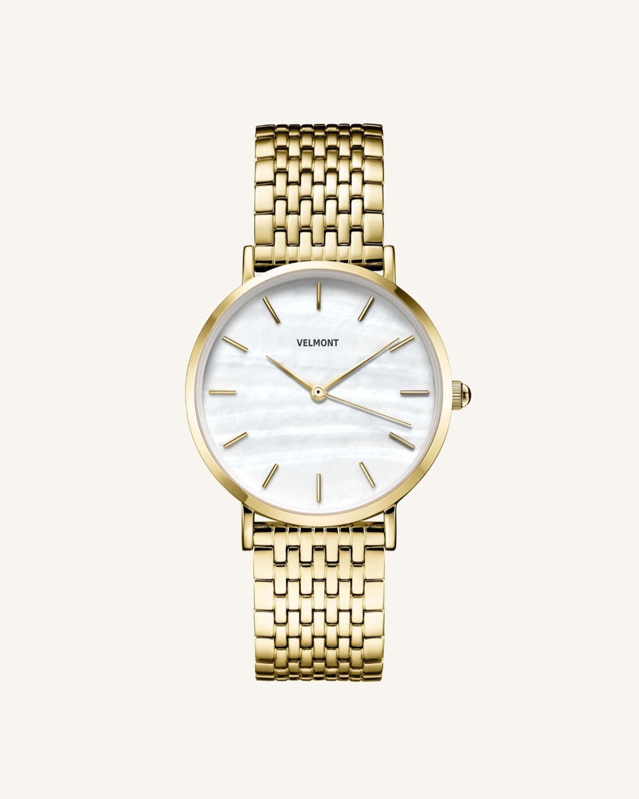 Gold-tone round watch with iridescent dial, front view