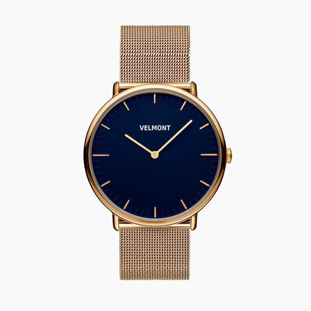 Watch with a blue sunburst dial and gold-tone case on a gold-tone mesh strap, shown from the front.