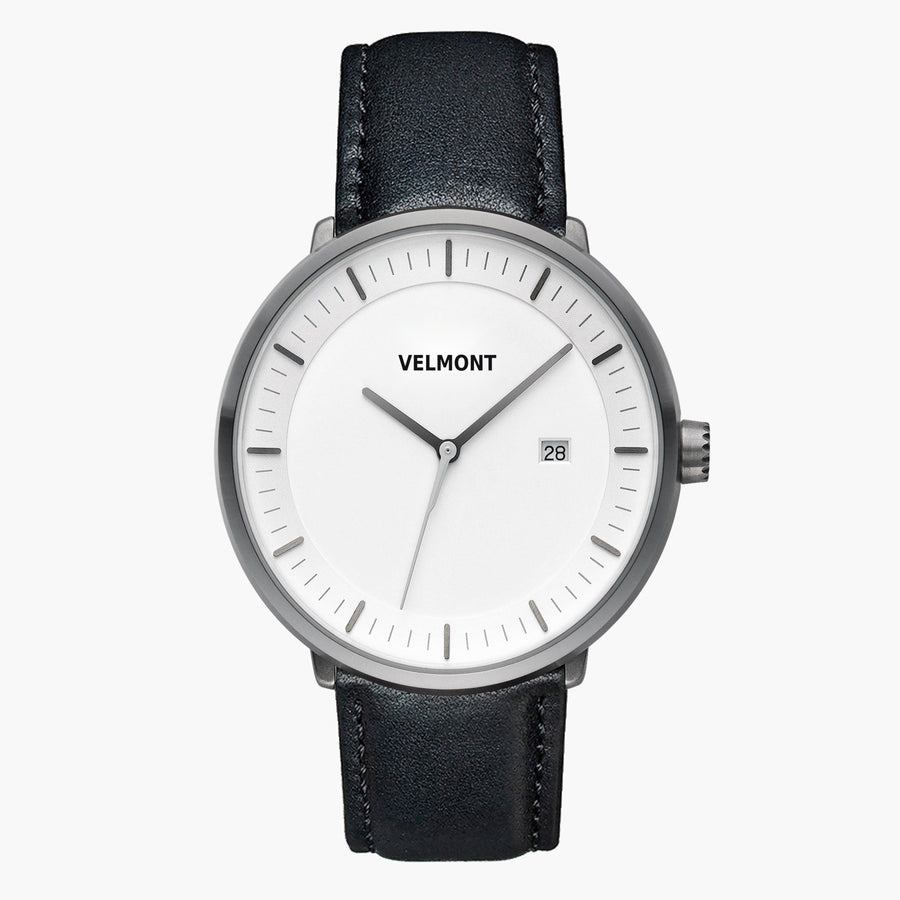 Straight-on look at the white dial and gunmetal case with its black strap.