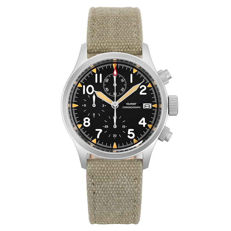 Chronograph with cream hands and orange accents on a khaki canvas strap, black background