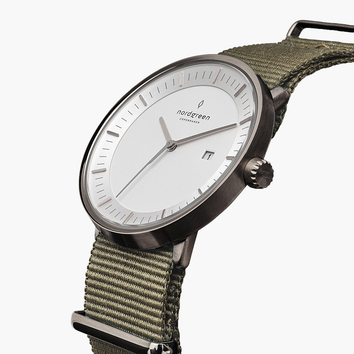 Angled view of the white dial, date window and dark gray crown.
