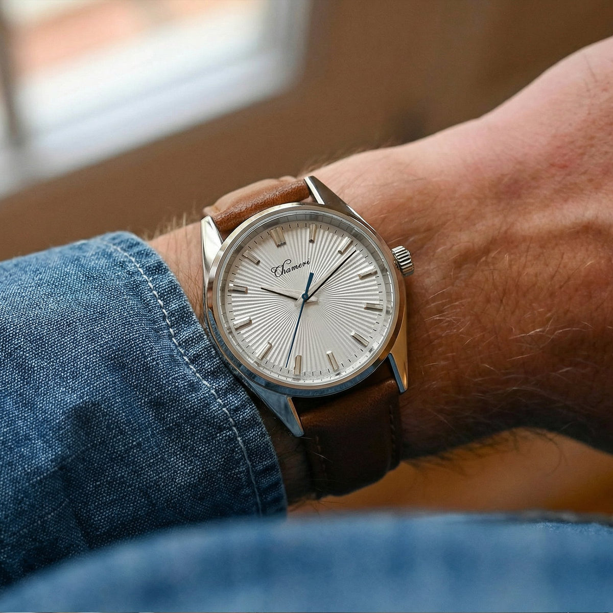 White sunburst dial watch on the wrist