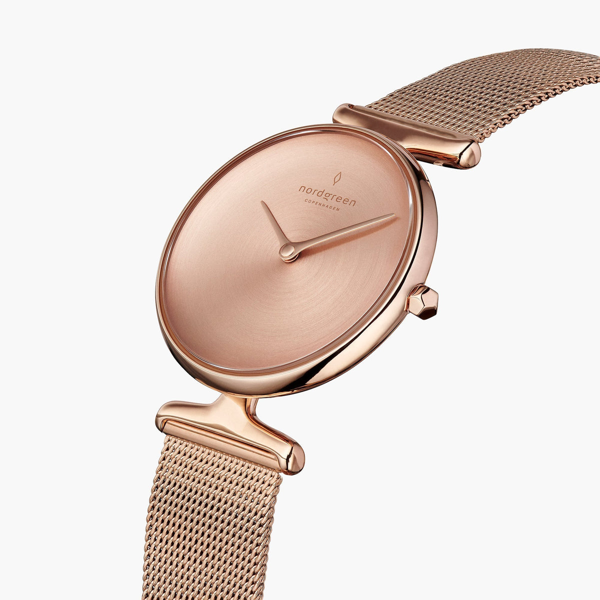 Angled view of the faceted crown and T-shaped lugs on a mesh strap.