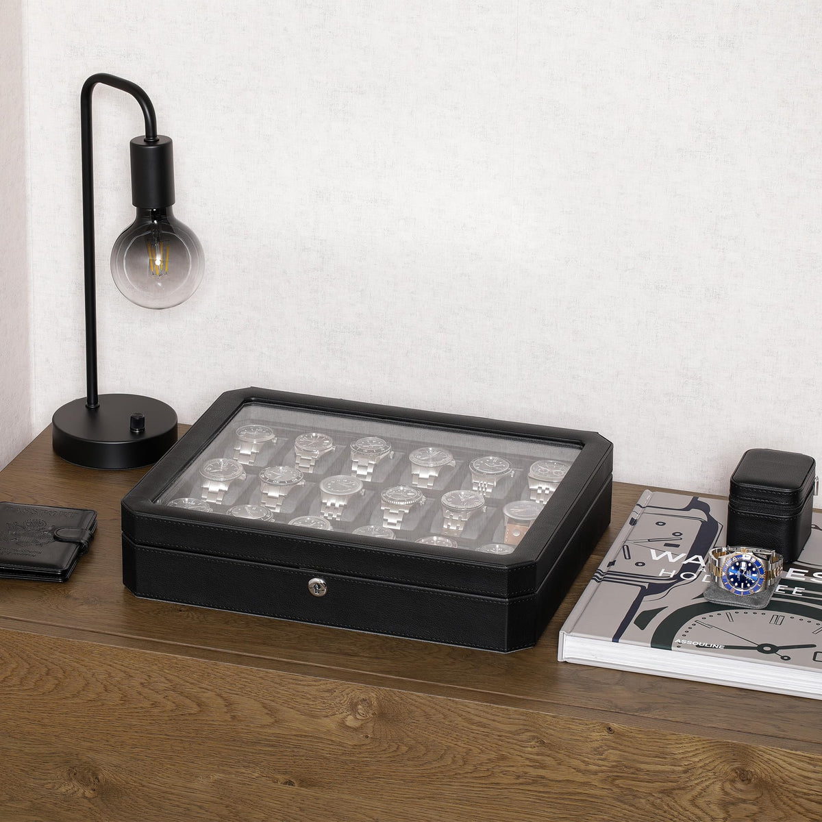Closed eighteen-watch case on a wooden desk