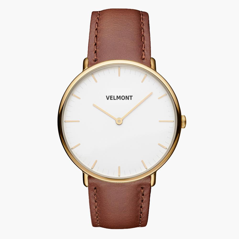Watch with a gold-tone case and white dial on a smooth brown strap.