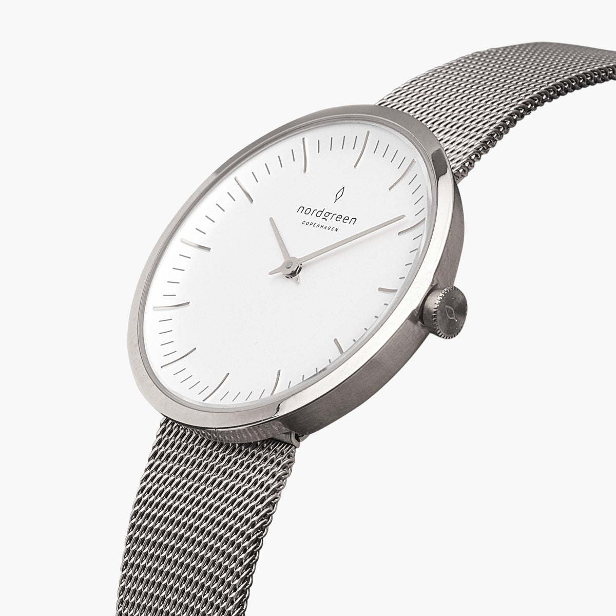 Angled view of the slim silver-tone case and white dial on mesh.