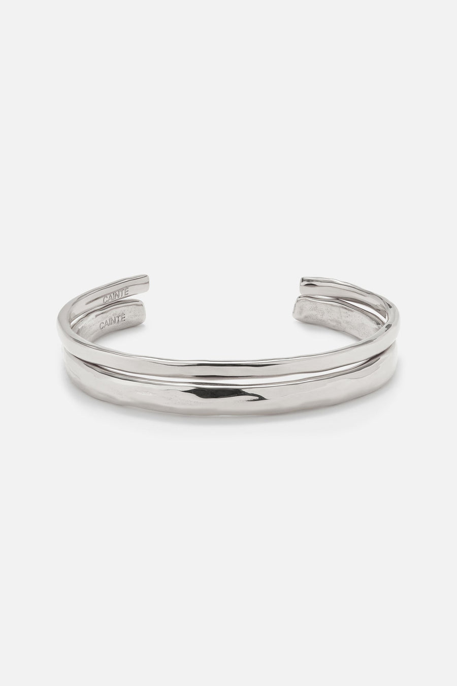 Silver-tone double band cuff bracelet, front view on a light background