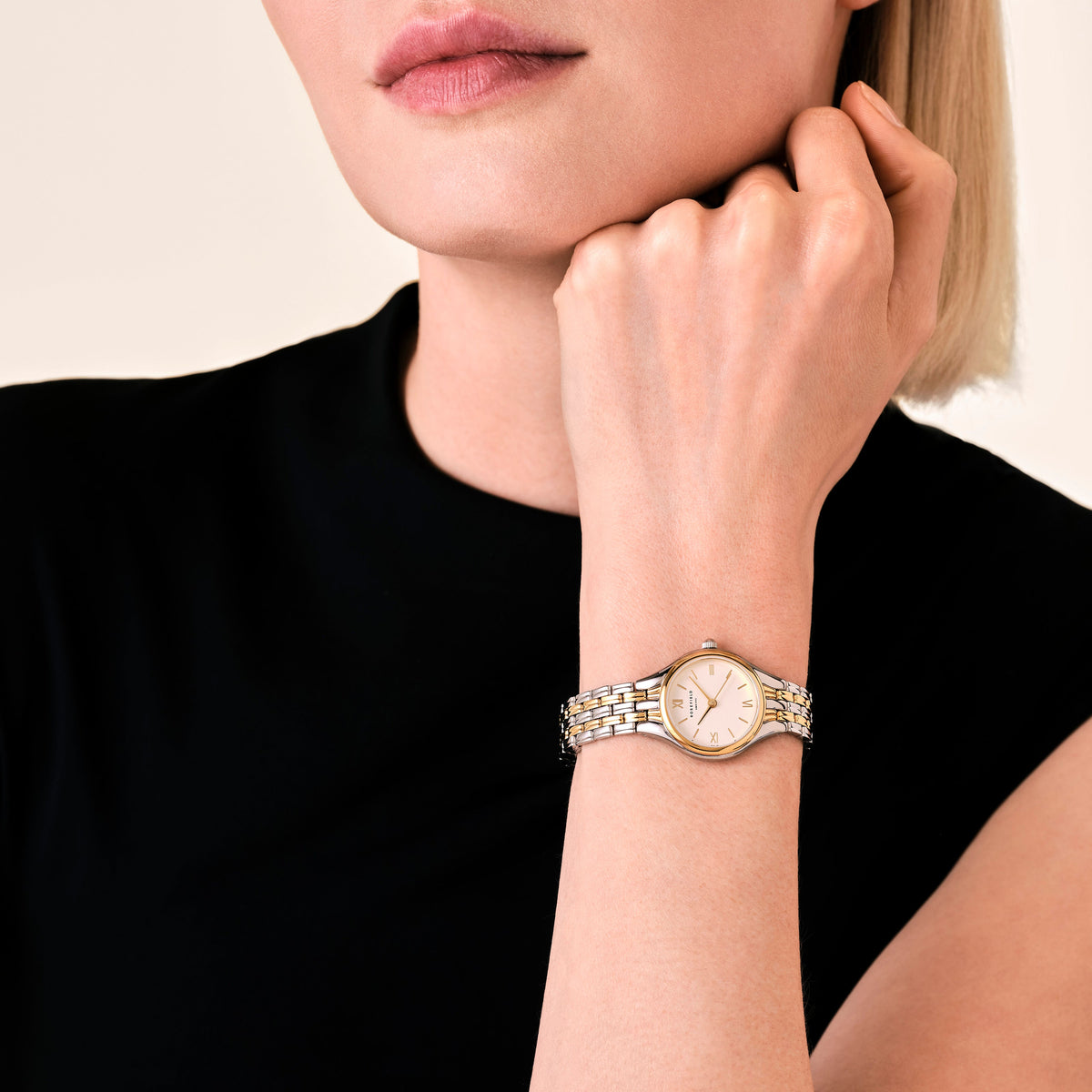 Two-tone watch worn with a black top