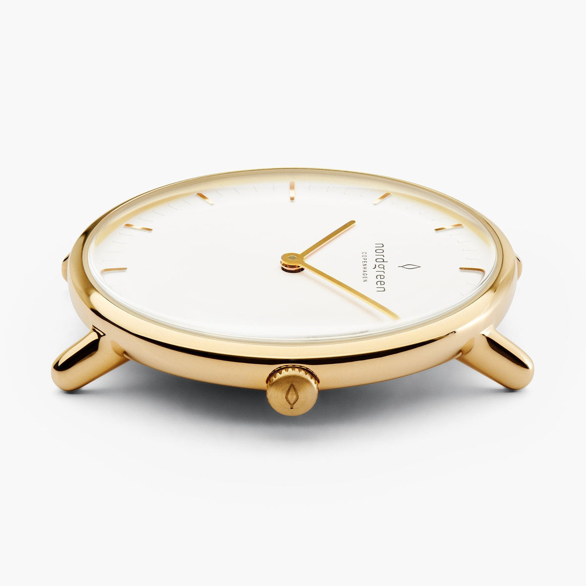 Low side angle of the gold-tone case with the white dial in view.