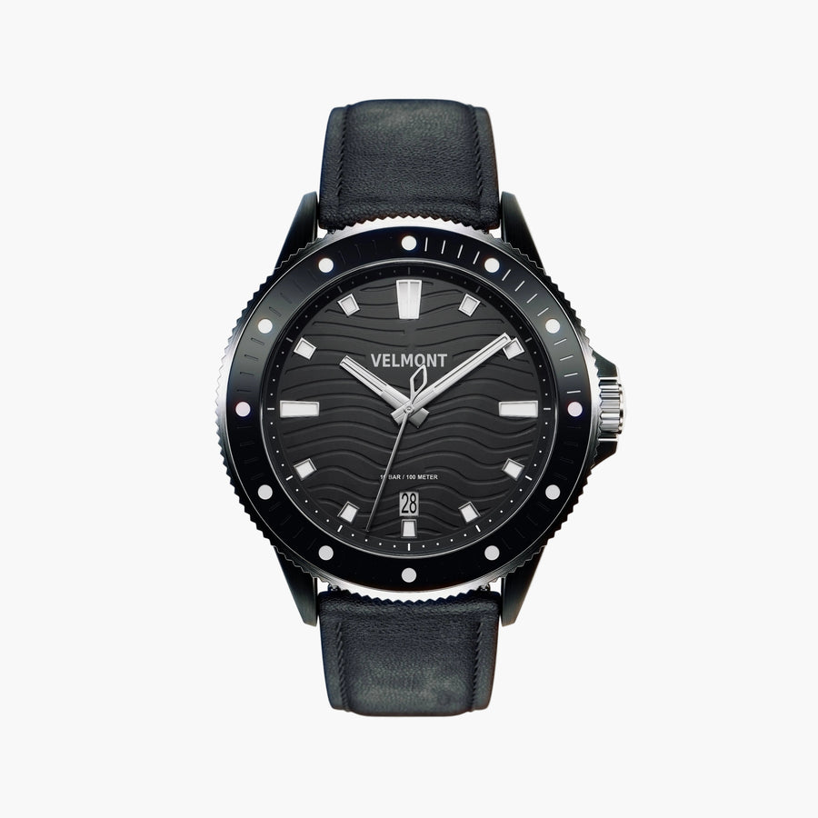 Black diver-style watch with a wave-textured dial and smooth black strap, front view.