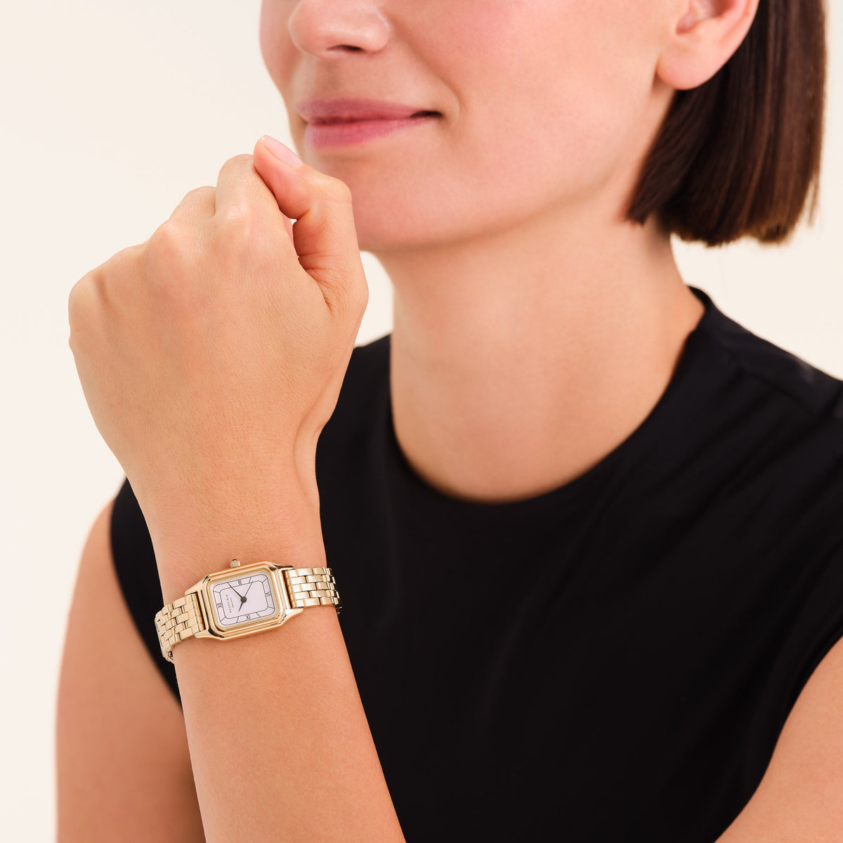 Dress watch worn with a black top