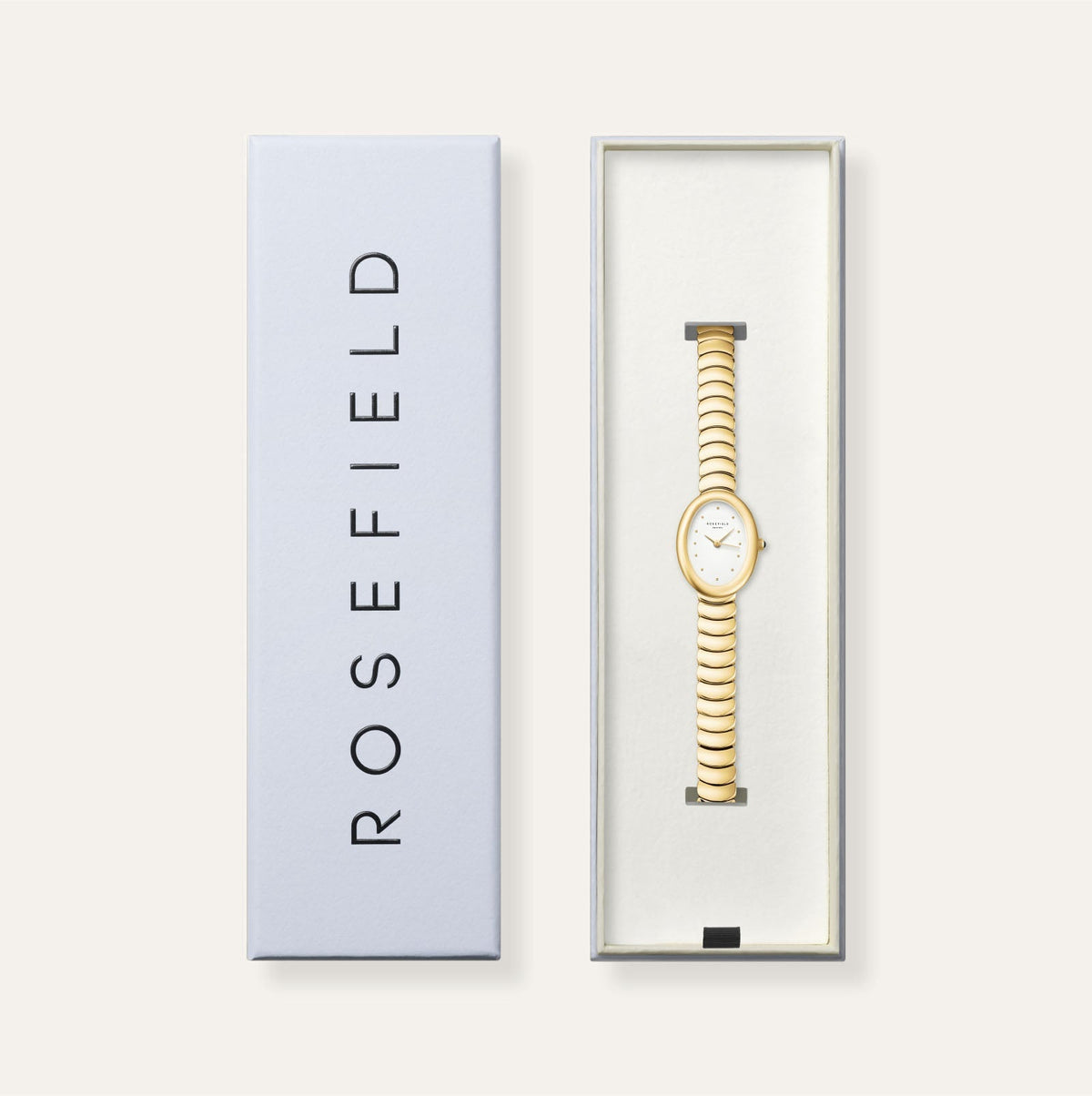 Gold-tone oval watch in its gift box