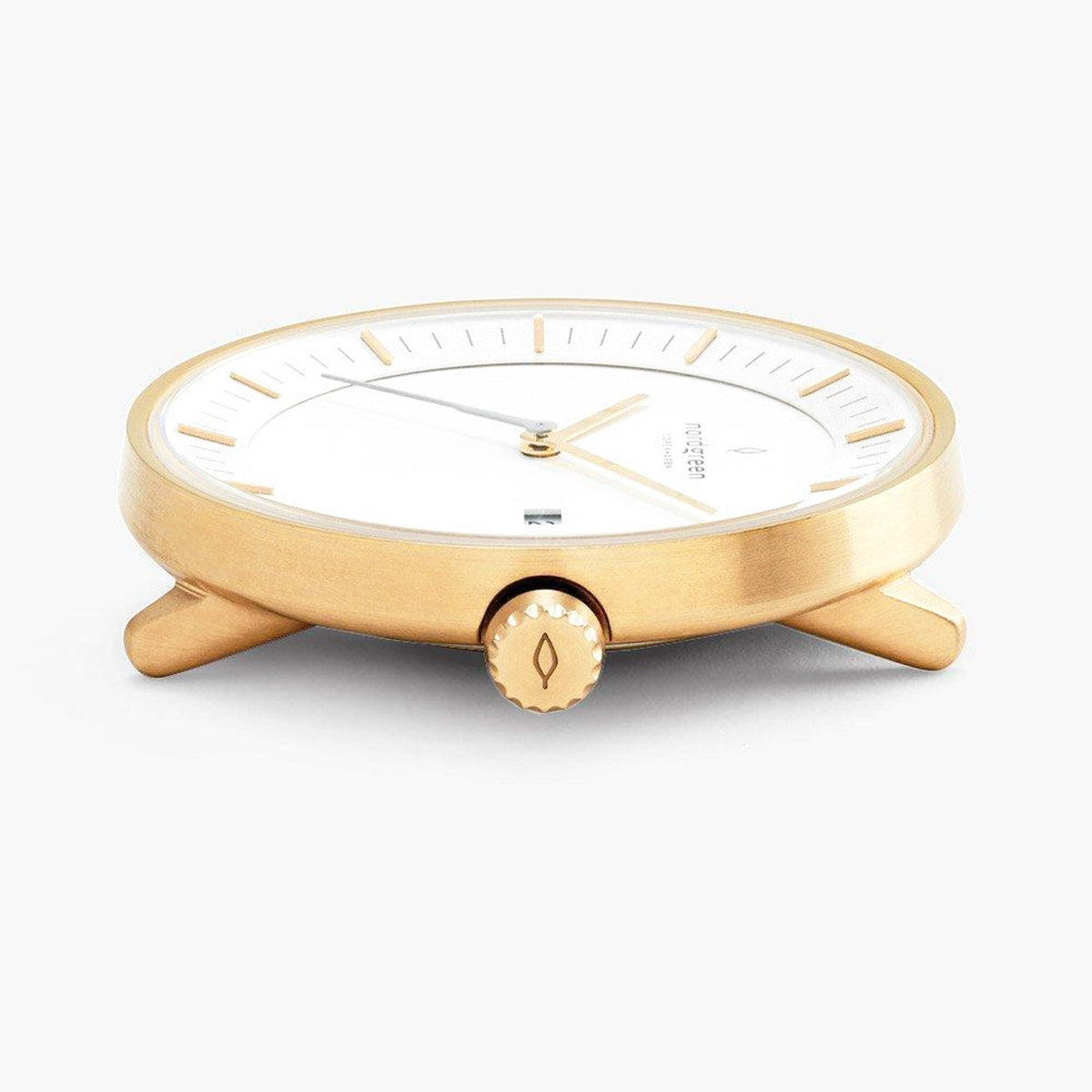 Side profile of the gold-tone case with a knurled crown.