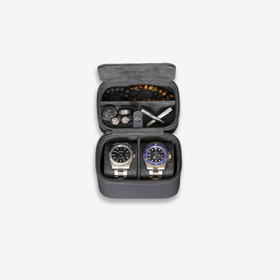 Open two-watch travel case with watches and bracelets inside