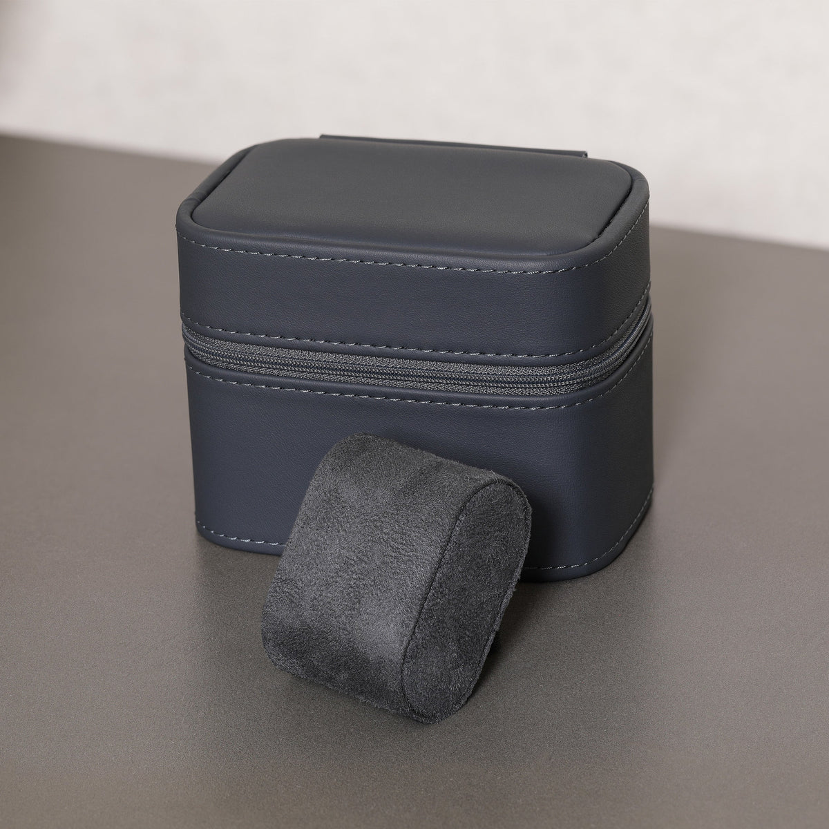 Closed travel case with a removed watch cushion