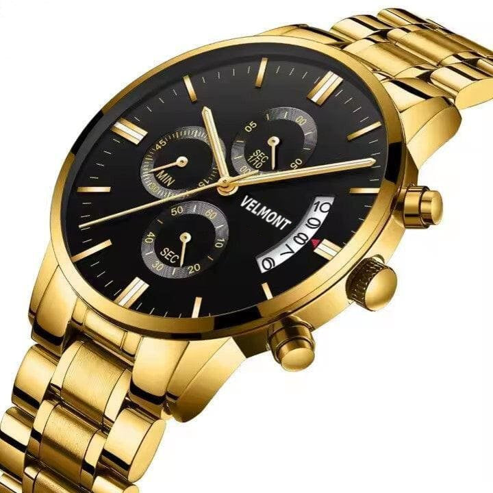 Gold-tone black dial watch at an angle