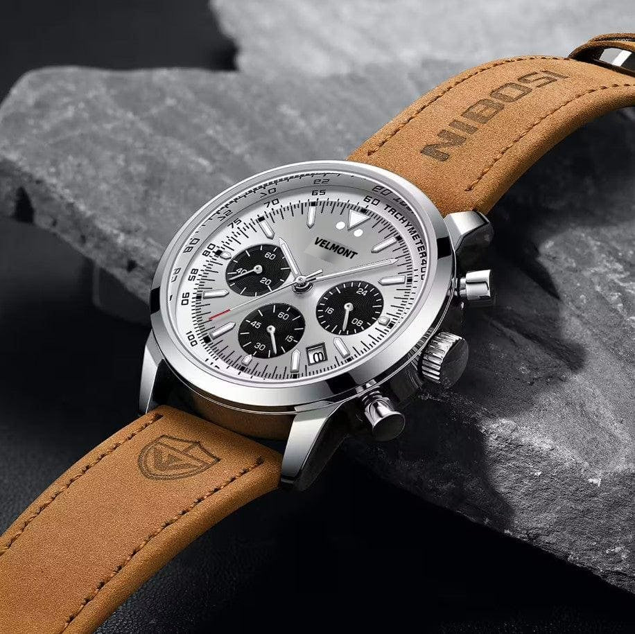 Silver chronograph on a stone surface