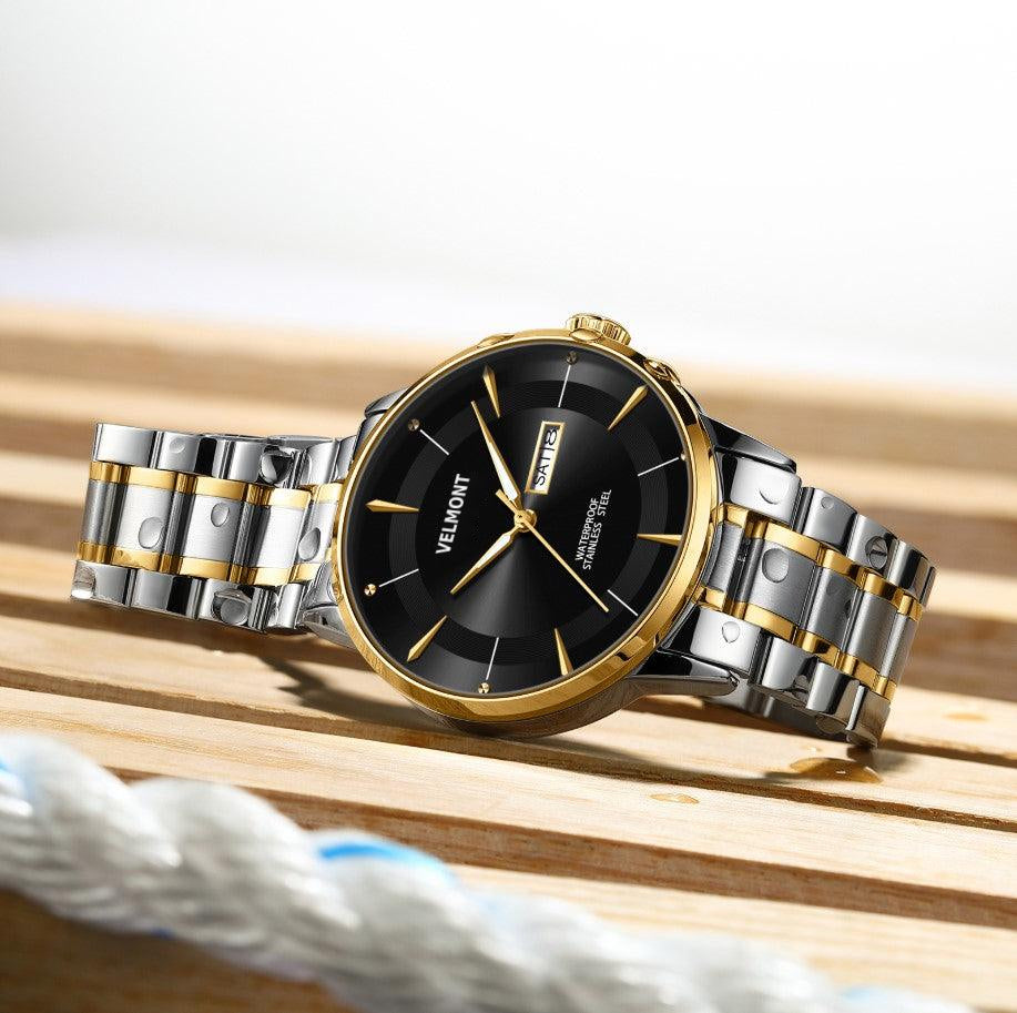 Two tone watch on wood and rope