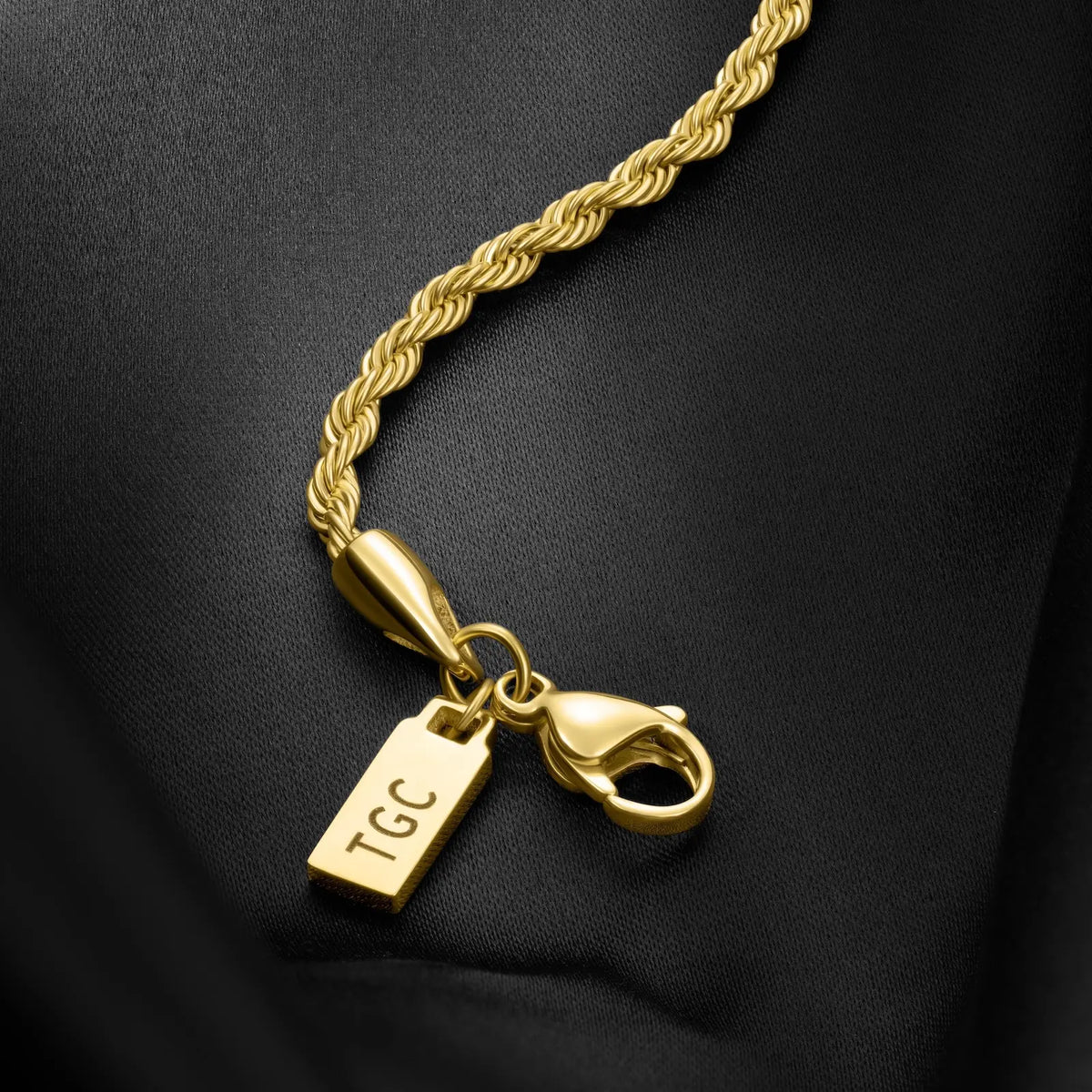 Close-up of the gold-tone lobster clasp and tag