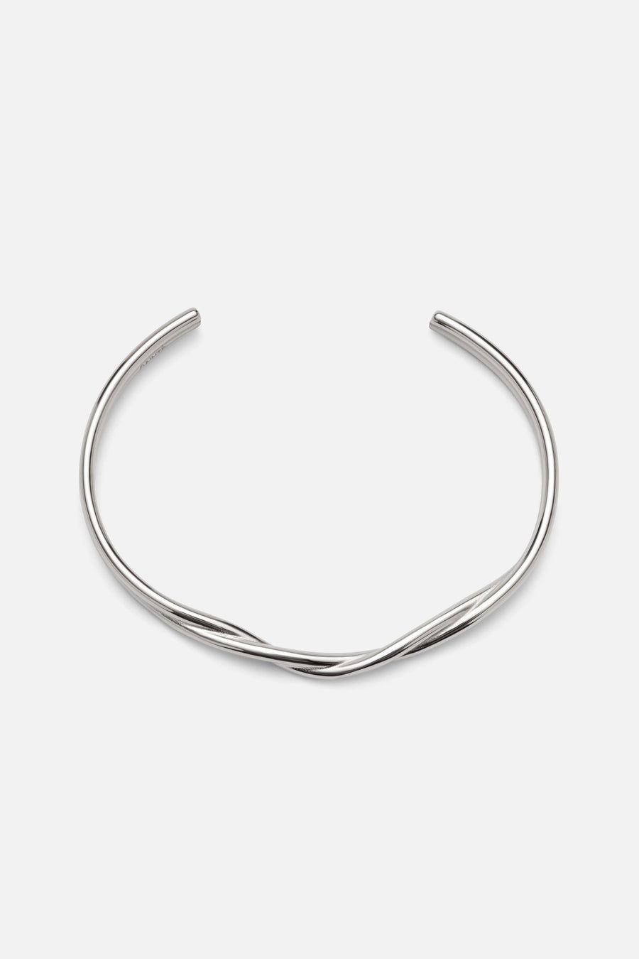 Silver-tone wavy crossover cuff, front view on a light background