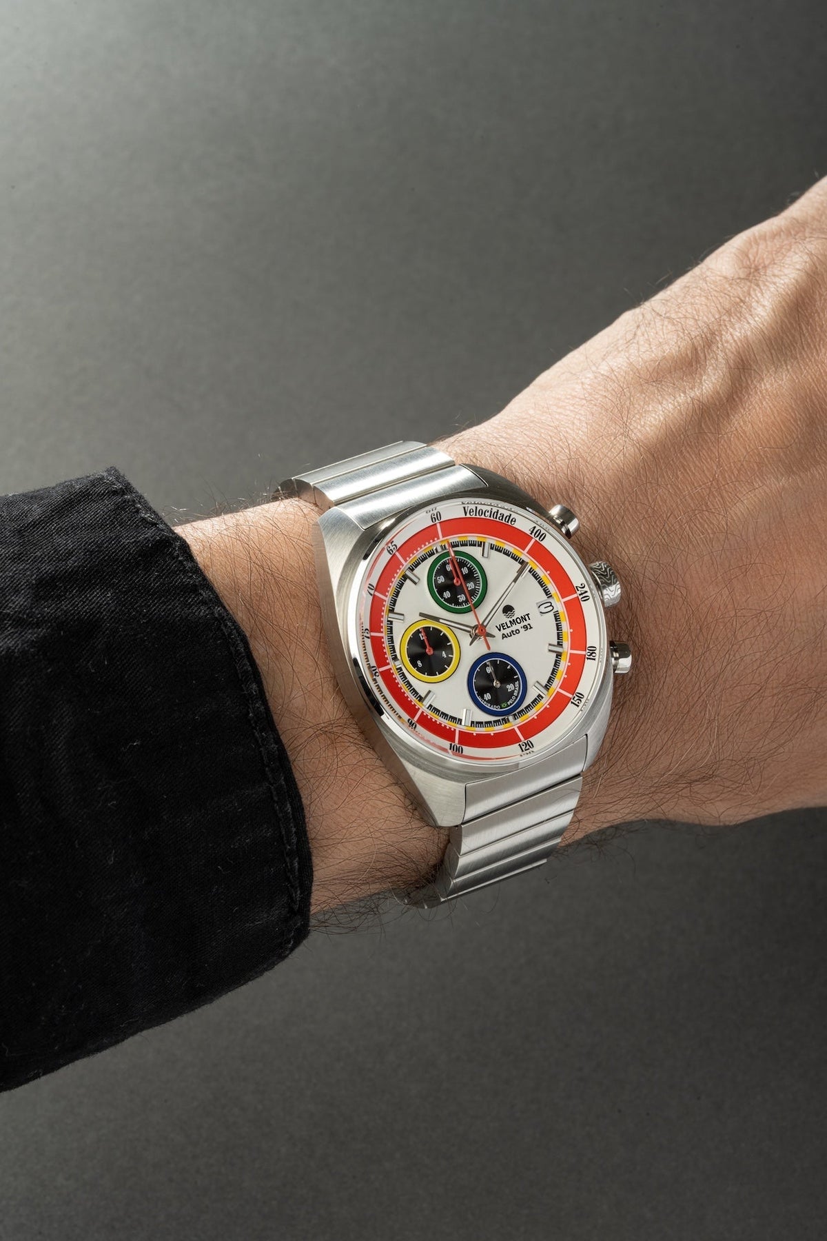 White chronograph on the wrist with a bracelet