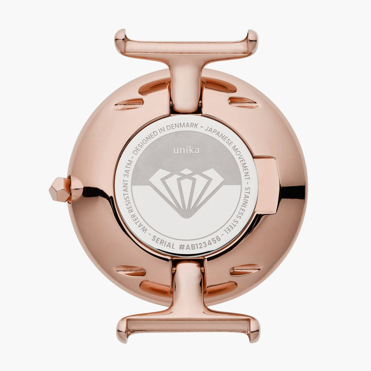 Polished rose gold-tone case back with an engraved center medallion.