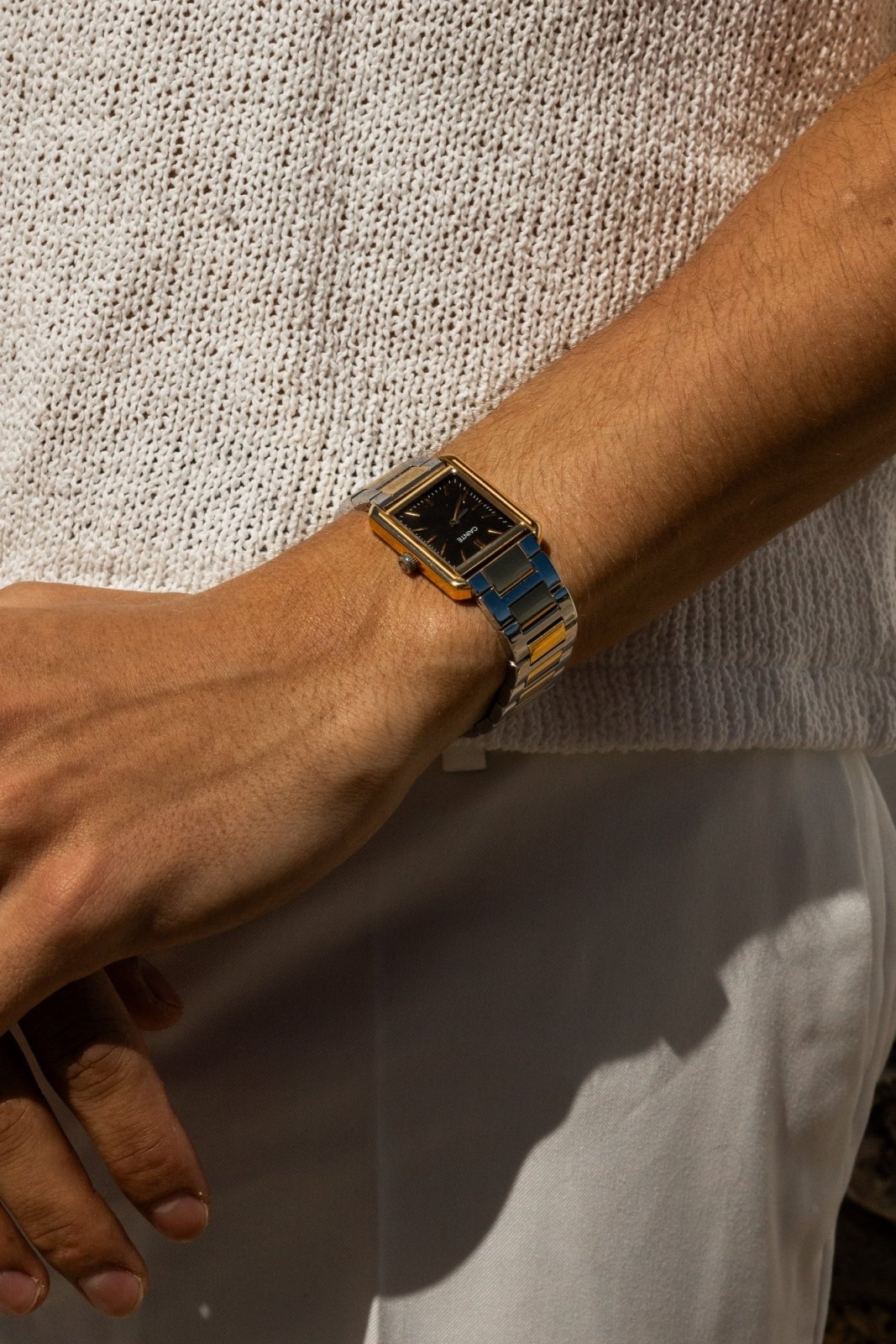 Close-up of the rectangular watch on the wrist