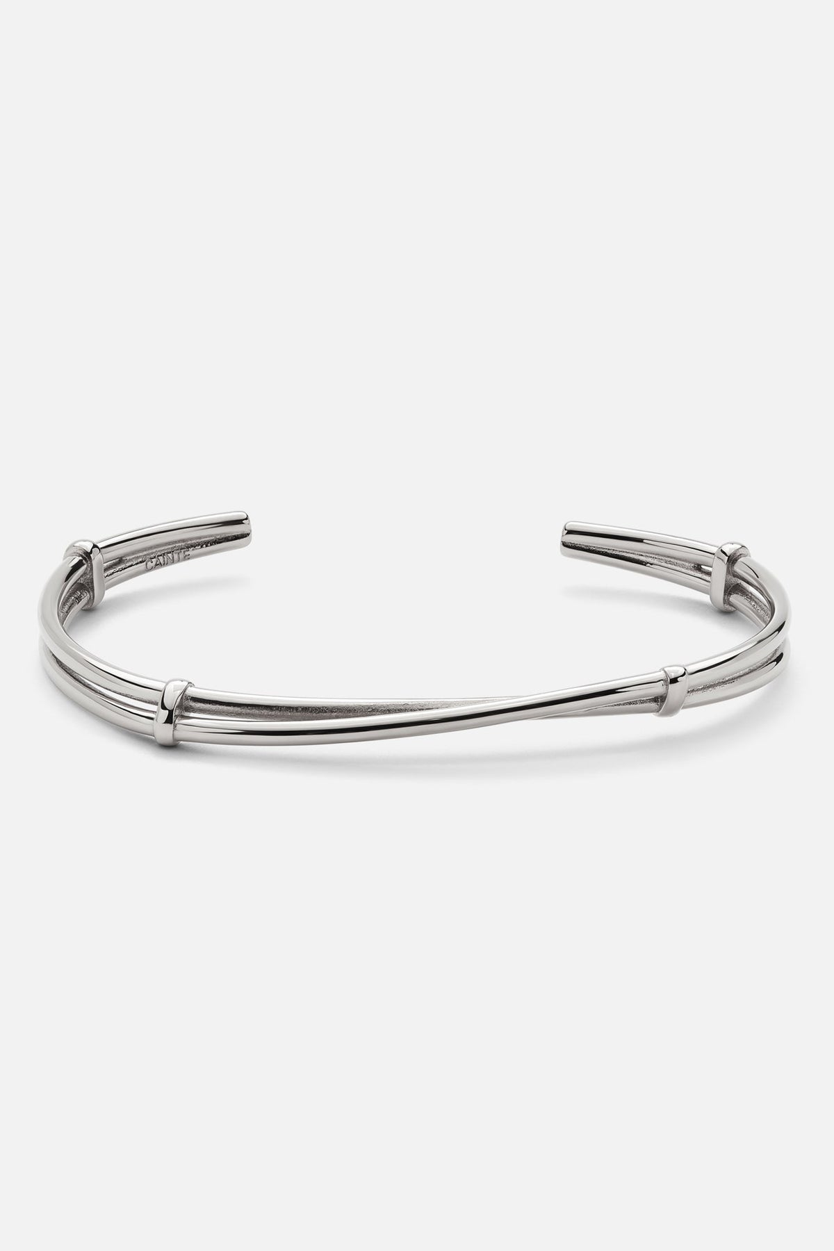 Silver-tone open twisted cuff bracelet, front view on a light background
