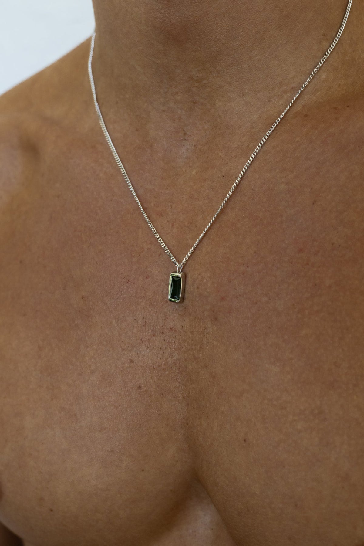 Silver-tone necklace with a rectangular green stone pendant, view 4 of 5