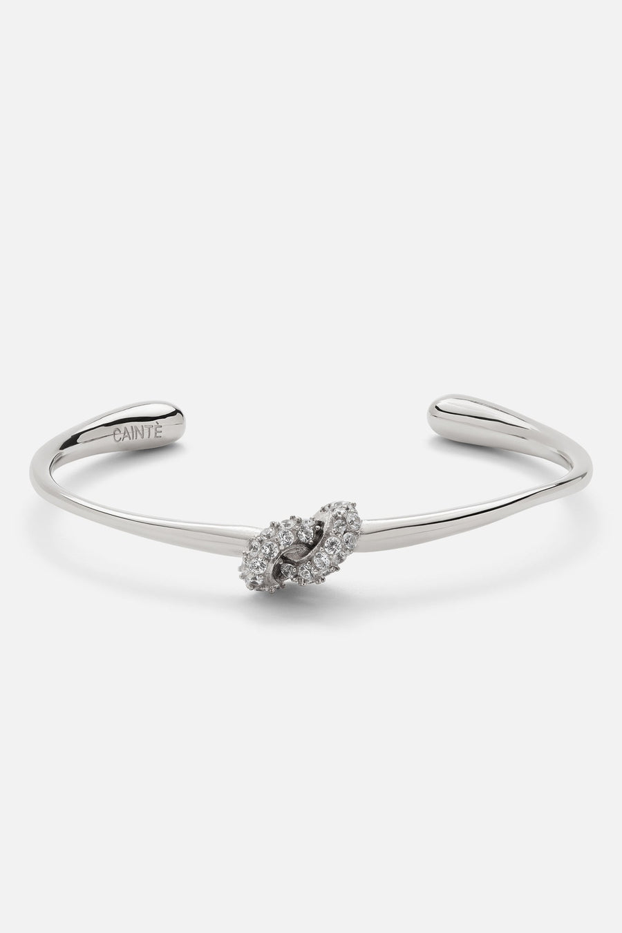 Silver-tone knot cuff bracelet, front view on a light background