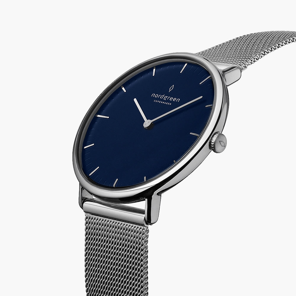 Blue dial and silver-tone crown seen from a three-quarter angle.