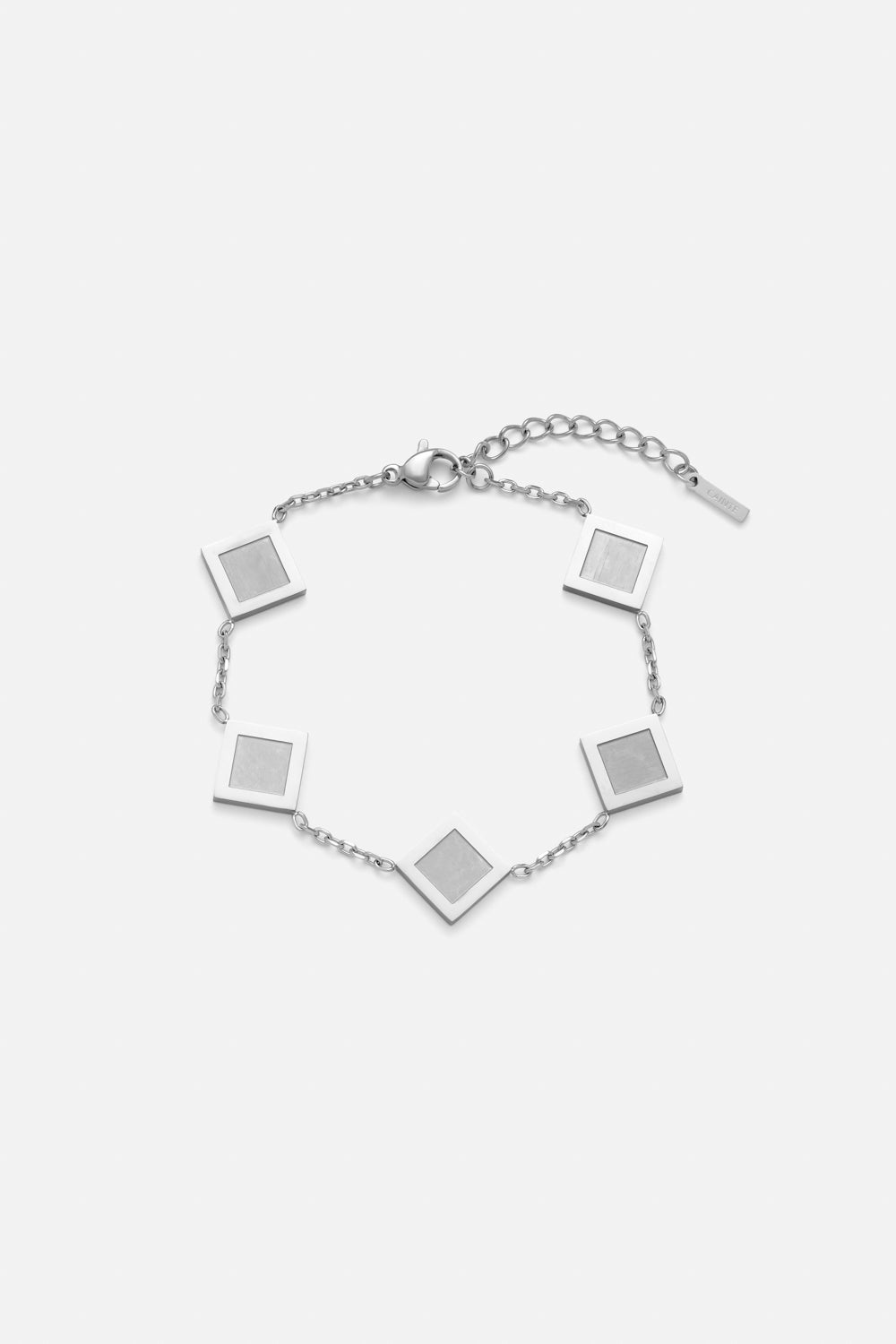 Silver-tone station chain bracelet with square plates, front view on a light background