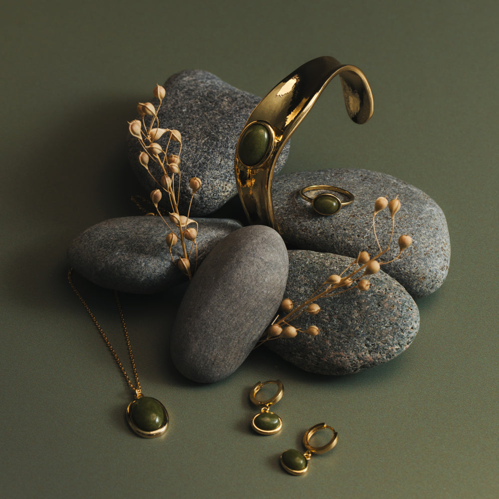Green stone cuff on stones with matching jewelry