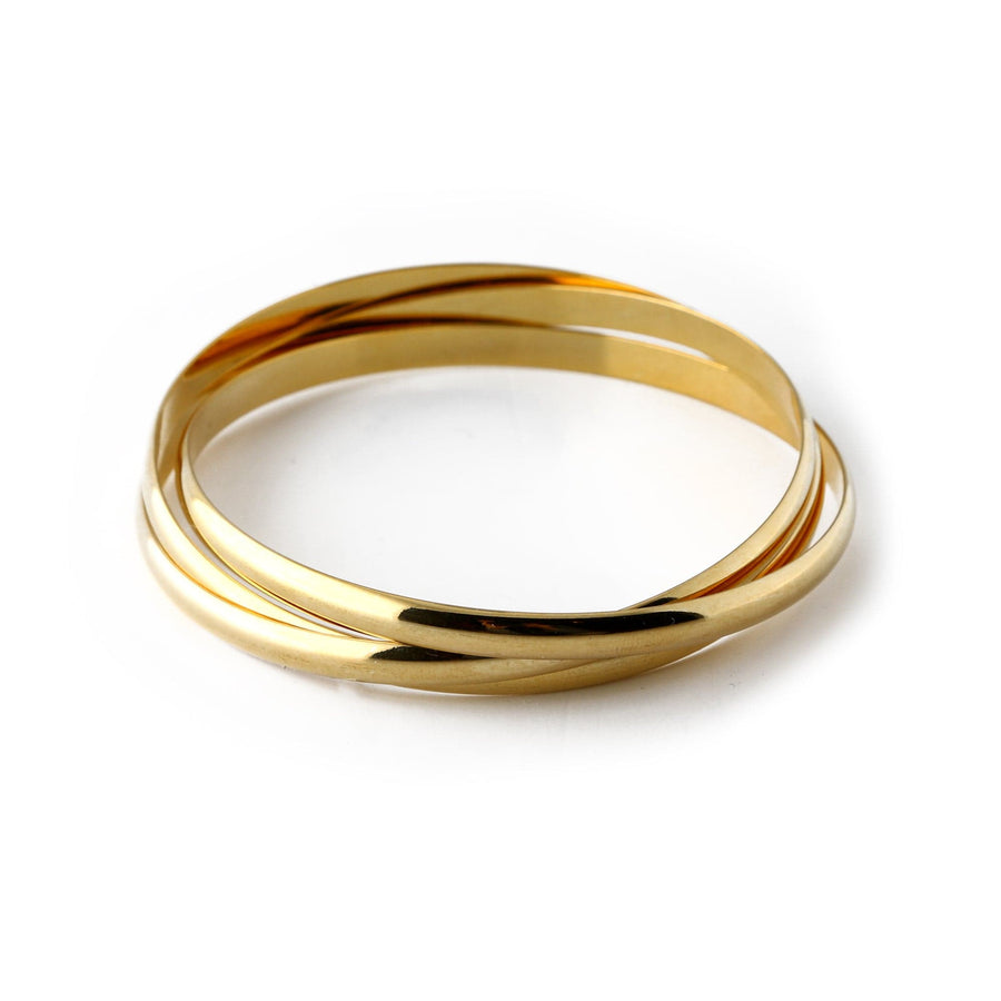 Three interlocking gold-tone bangles