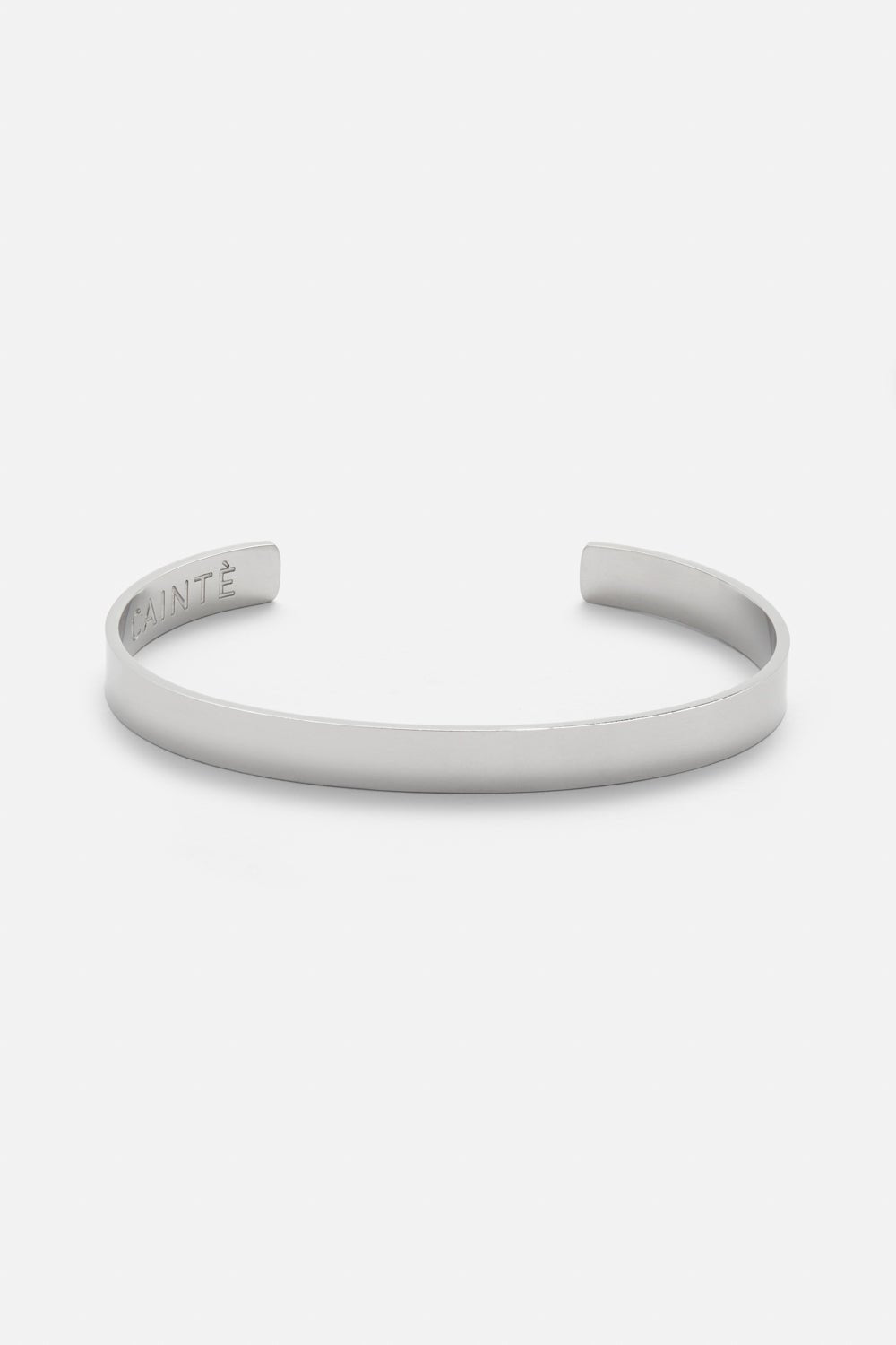 Silver-tone polished cuff bracelet, front view on a light background