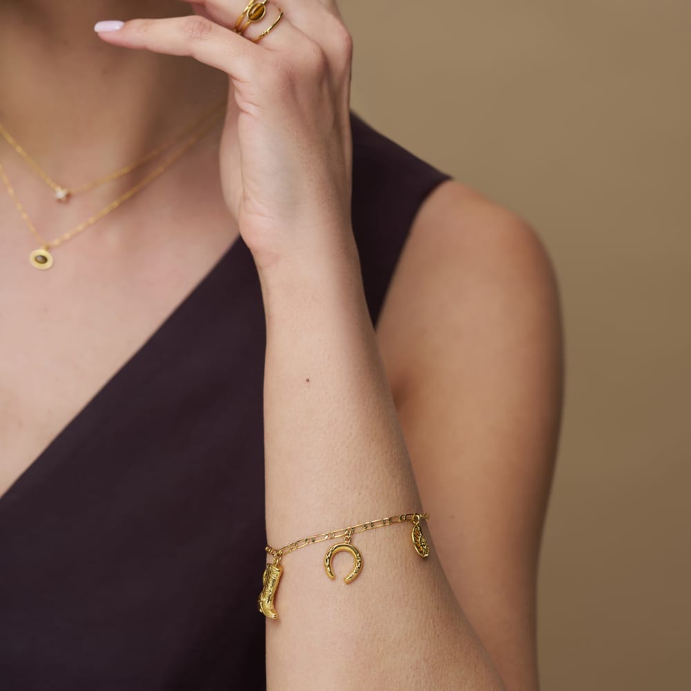 Western charm bracelet worn on the wrist
