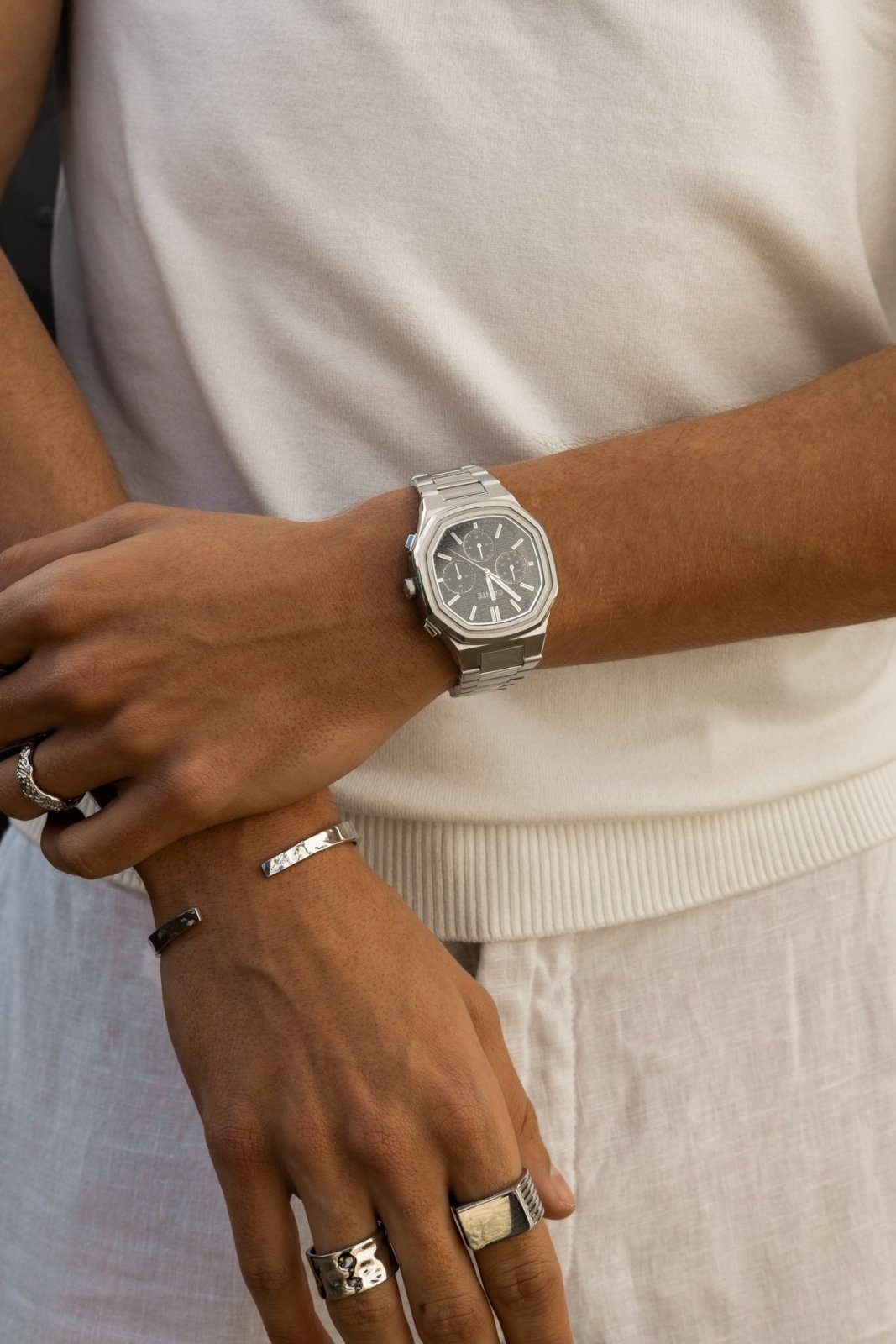Close view of crossed arms with the watch