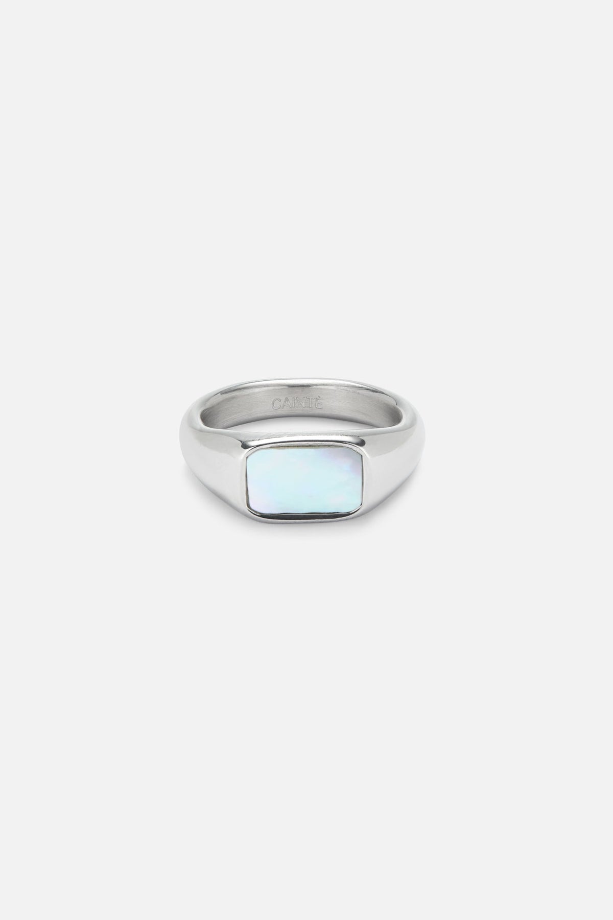 Signet ring with a white iridescent inlay, front view