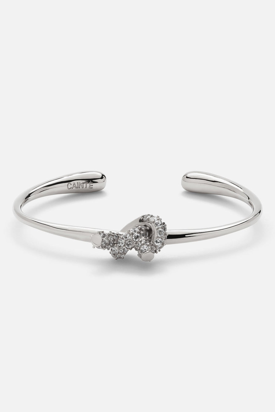 Silver-tone textured knot cuff bracelet, front view on a light background