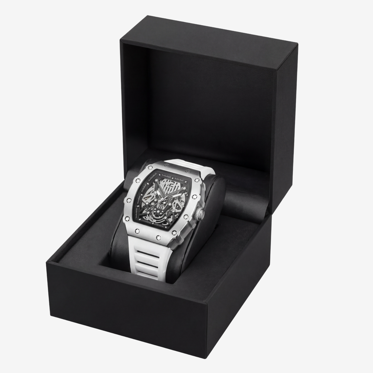 Skeleton watch with white strap in an open black presentation box