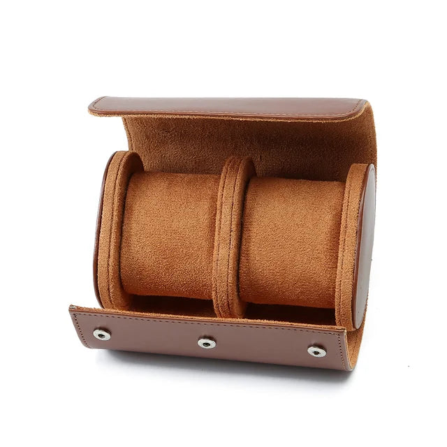 Open brown watch roll with two tan pillows