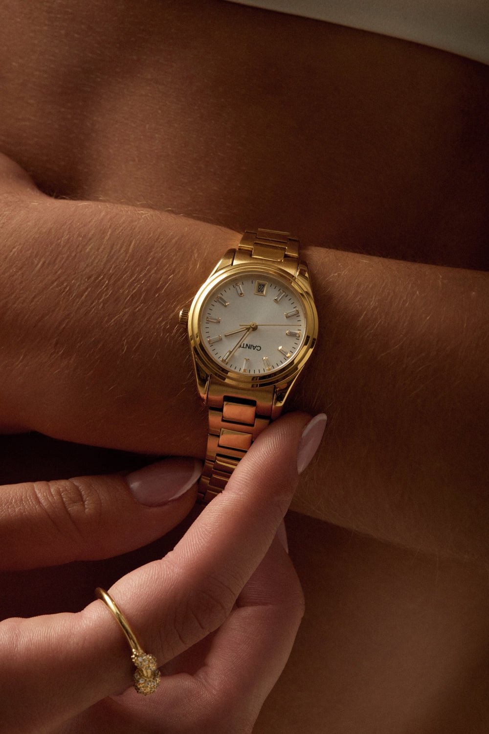Woman adjusting the watch on her wrist