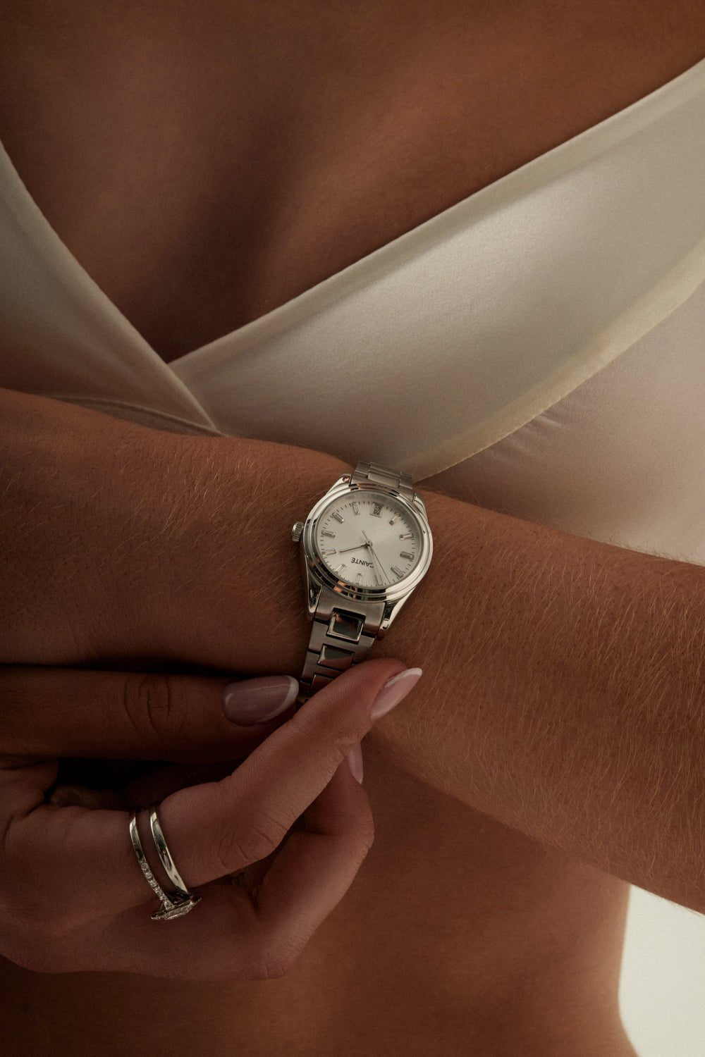 Woman adjusting the watch on her wrist