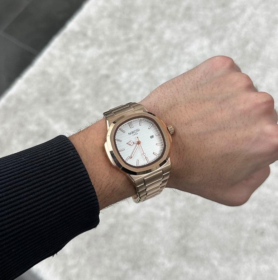 White dial watch on the wrist