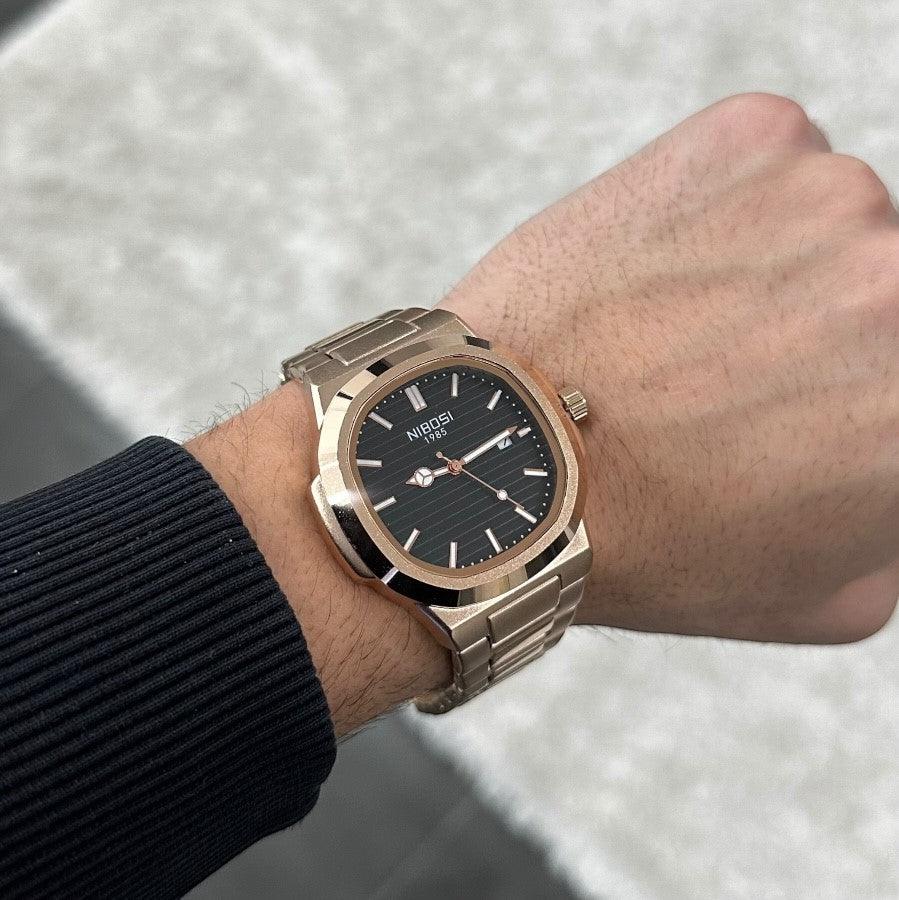 Black dial watch on the wrist