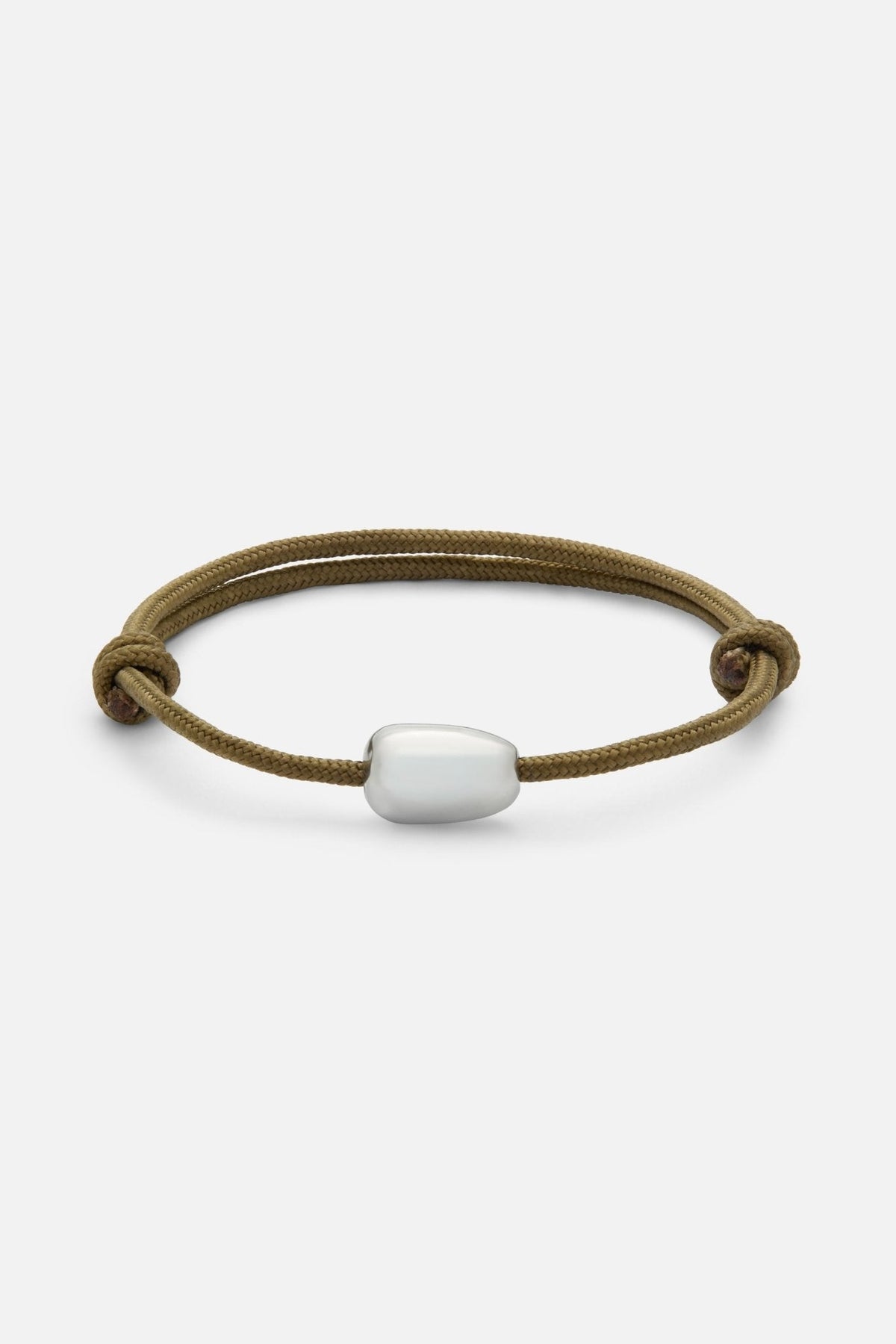 Brown cord bracelet with a white bead, front view on a light background