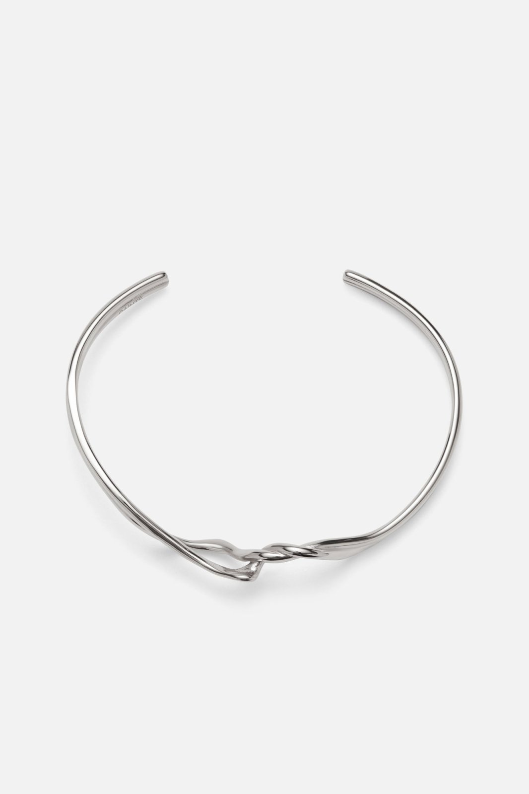 Silver-tone crossover twisted cuff, front view on a light background