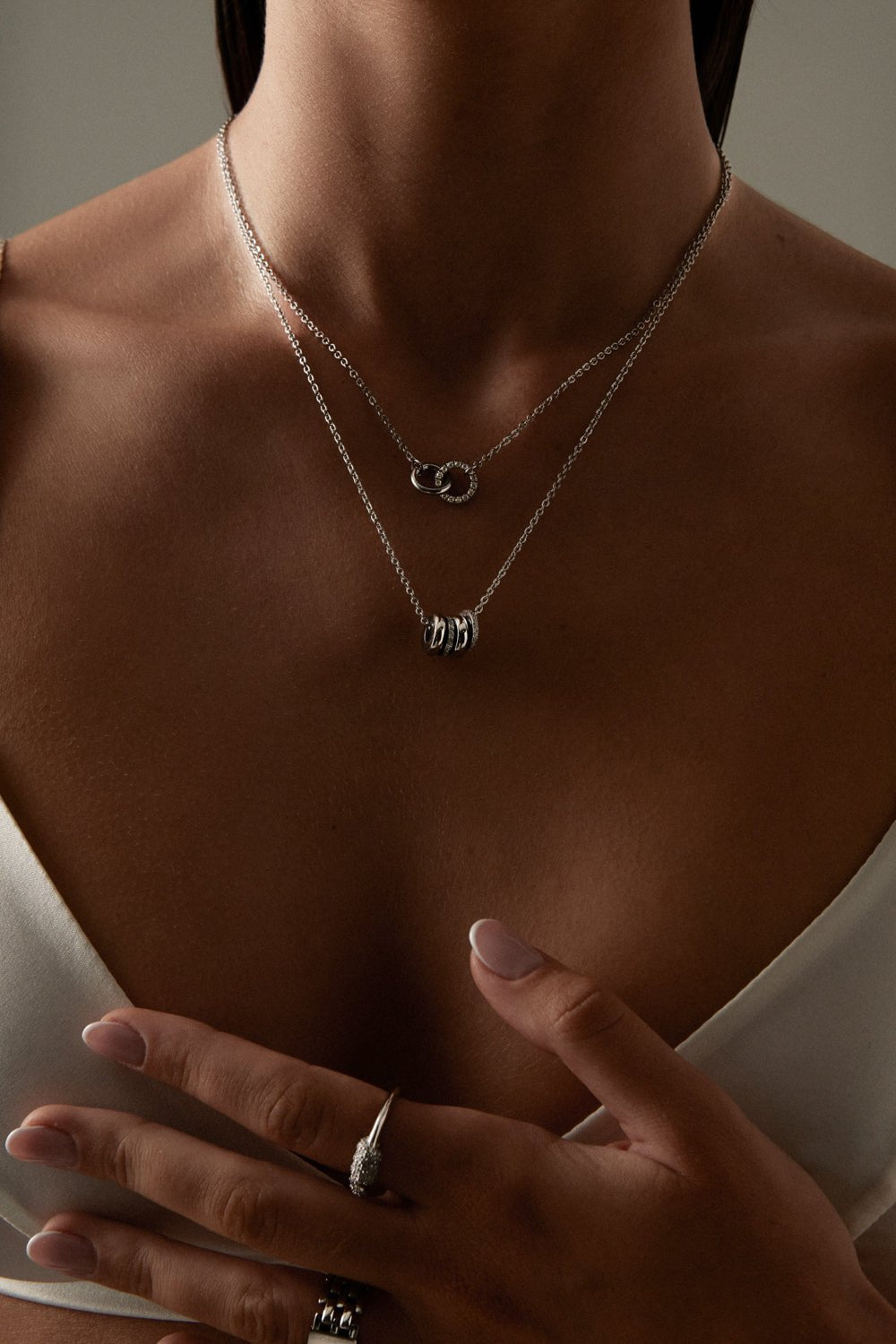 Silver-tone necklace with a cluster of small rings, view 8 of 8