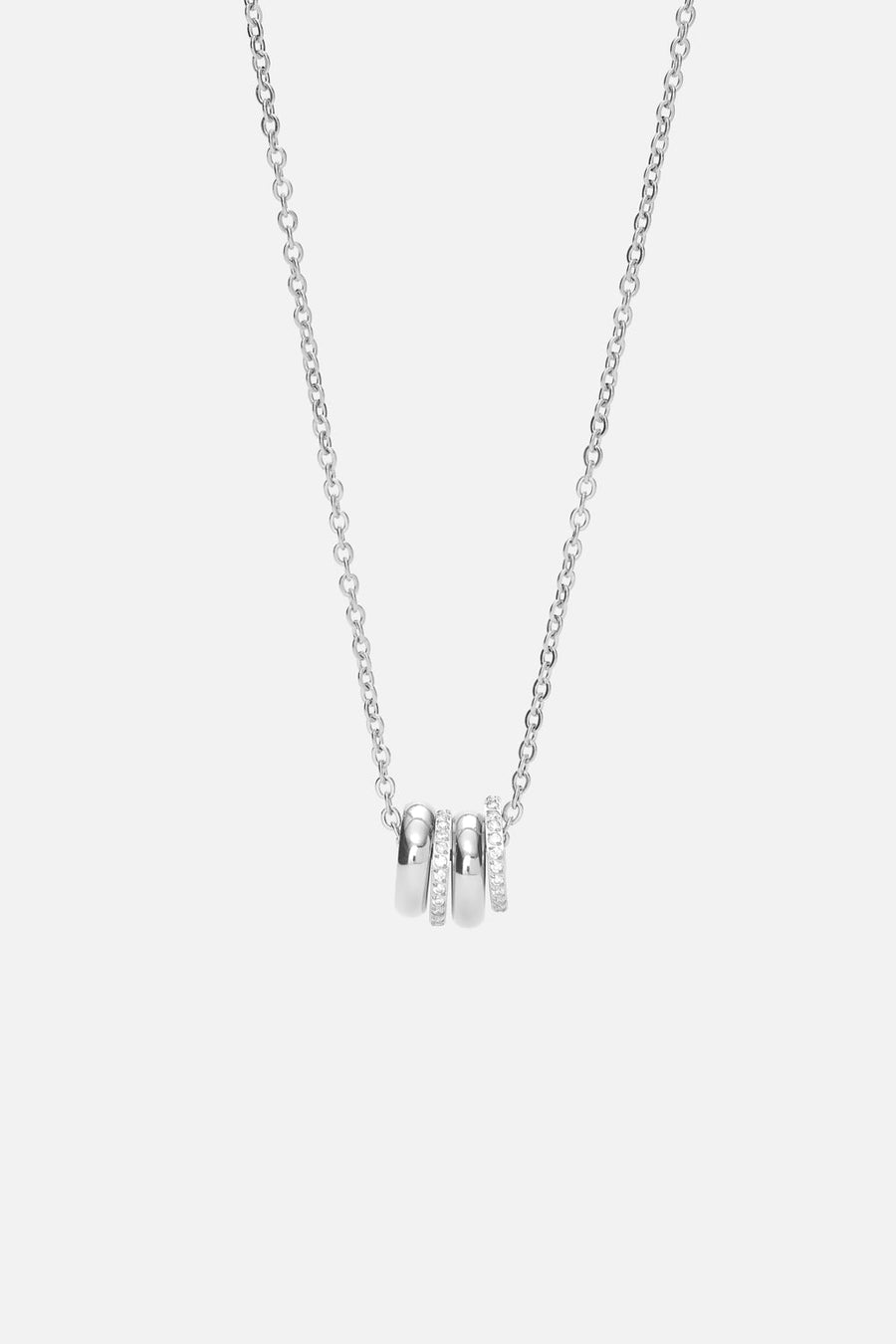Silver-tone necklace with a cluster of small rings, front view on a light background
