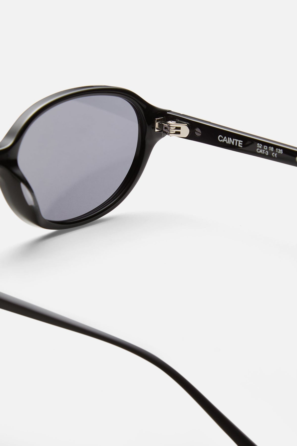 Close-up of the hinge and gray oval lens